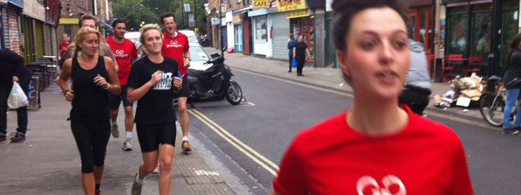 GoodGym runners stretching out after a run